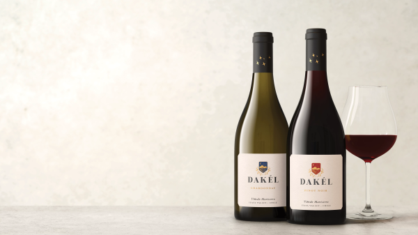 Two bottles of Dake with a glass of wine